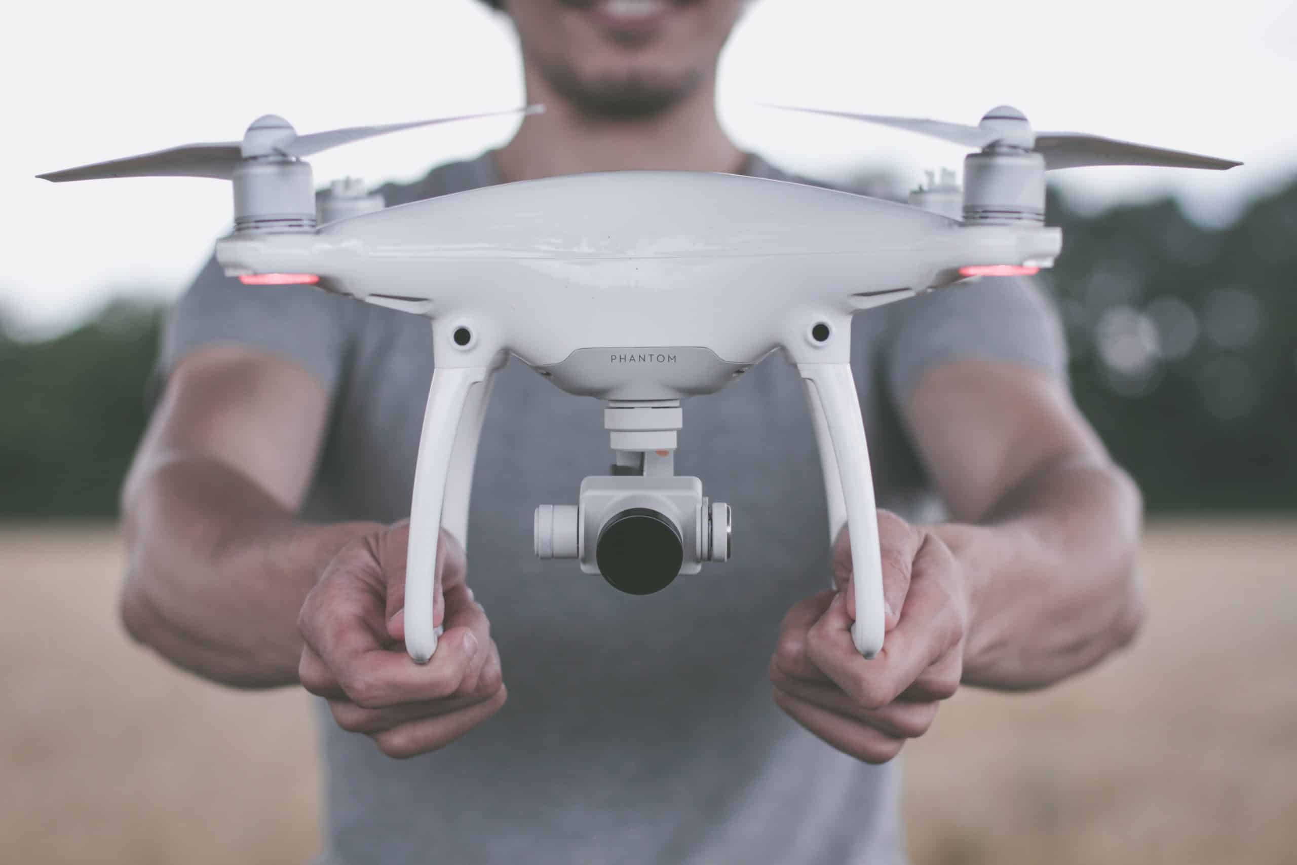Holding a drone preparing for drone photography and videography Holding a drone preparing for drone photography and videography